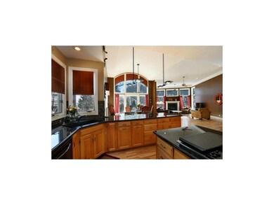 Kitchen with granite counters, maple cabinets and 