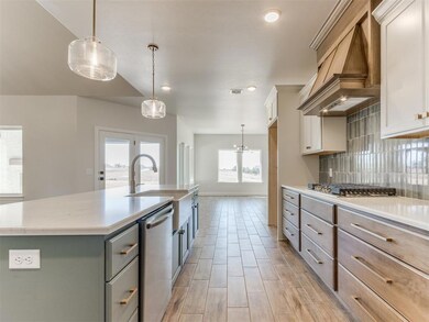 Kitchen with custom exhaust hood, stainless steel 