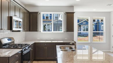 Kitchen with appliances with stainless steel fini