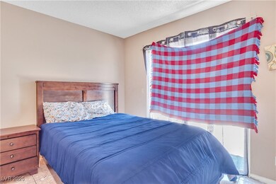 Bedroom with a textured ceiling