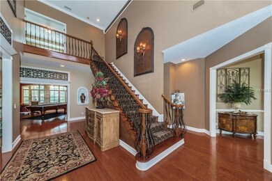 THE GRAND FOYER WITH VAULTED CEILING, CUSTOM OAK A