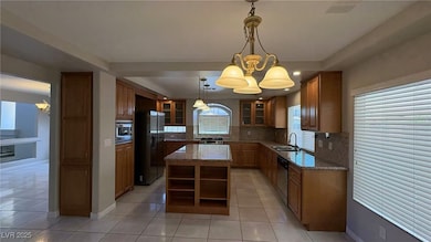 Kitchen featuring stainless steel appliances, a si