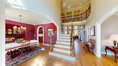 Grand foyer showcasing coffered ceilings in great