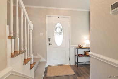 Foyer entrance featuring dark wood finished floors