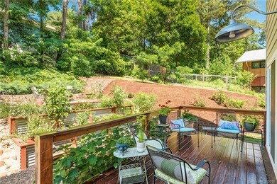 Stained back deck includes stainless steel cable rails and easy access to backyard.