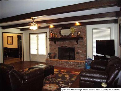 Den, new floors, exposed beams, fresh paint
