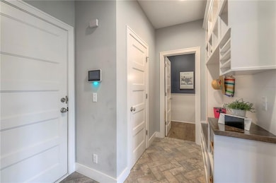 Entrance from garage, mudroom and 1/2 bath