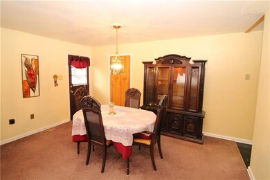 Dining Room w/ Side Door to Concrete Patio.... Per