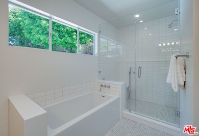 Master bath with tub and seated shower