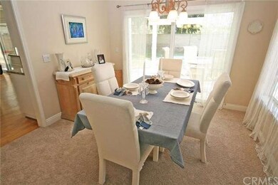 A look at the formal dining area with a view out t