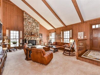 Step inside to a vaulted great room with rock fire