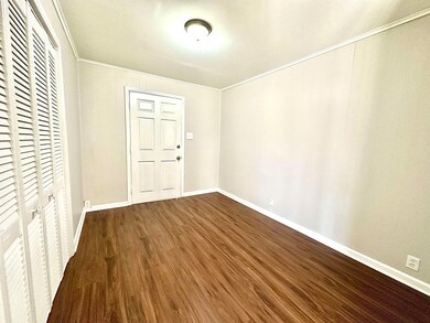 Interior space featuring a closet, ornamental mold