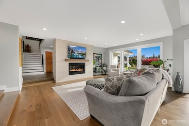 Living room. Solid wood floating mantel above fireplace.