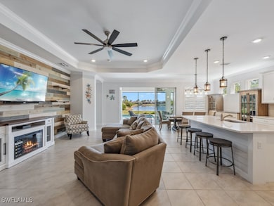 Living room with plenty of natural light, light ti