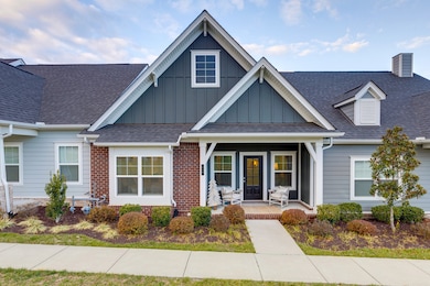 Side on the porch and enjoy the view of hills in the distance, and visit with neighbors as they stroll by.