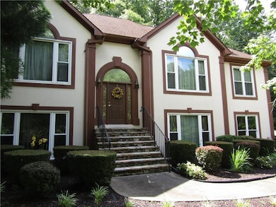 Doorway to property with stucco siding