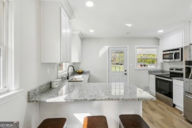 Updated Kitchen With Stainless Steel Appliances & Granite Counters