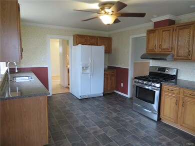Eat in kitchen with ample cupboard space and grani