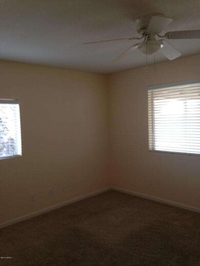 Beds, Tan Carpet, Ceiling Fans