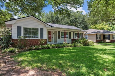Ranch-style home with a front yard