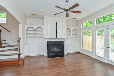 Built in custom cabinets in the living area surrou