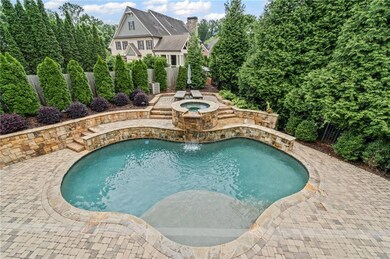 View of pool with an in-ground hot tub, a fenced backyard, and a patio area