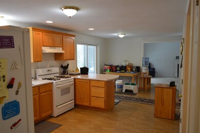 Clean and bright kitchen.    Sliders on the left l