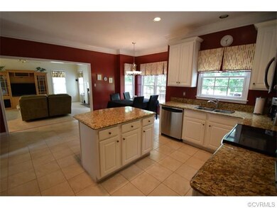 Updated open kitchen with granite tops, tile floor