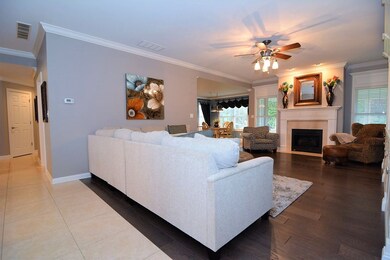 Large open living room with gas fire place.