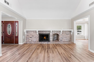 The wood burning brick fireplace is the focal poin