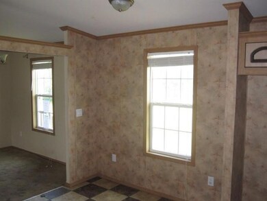 Spare room featuring tile flooring, ornamental mol