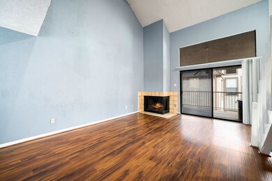  Large sliding glass doors open to a balcony, brin