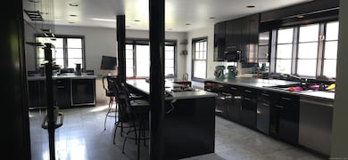 Chefs kitchen with 2 sinks, sub. zero frig, dishwasher and two wall ovens...
