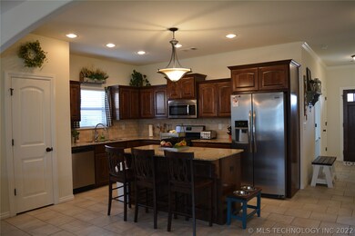 Open kitchen with lots of storage. Pantry door on
