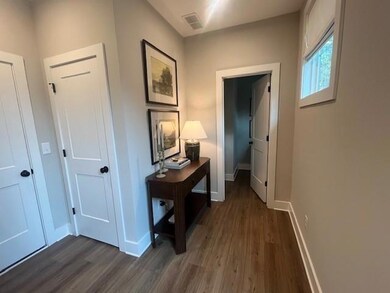 Hallway with dark wood-style floors