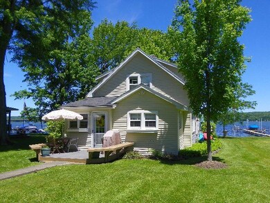The entrance of the home has a deck with built-in 