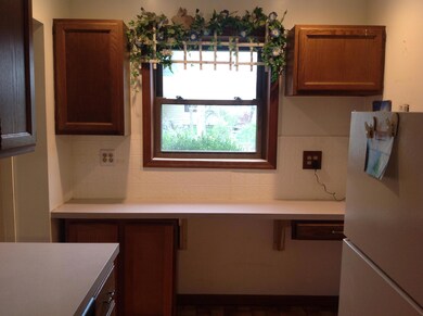Kitchen has buffet and window
