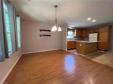 The dining room opens up to the spacious kitchen with cook top!!  There's lots of counterspace!