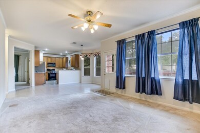 Unfurnished living room with ornamental molding, 