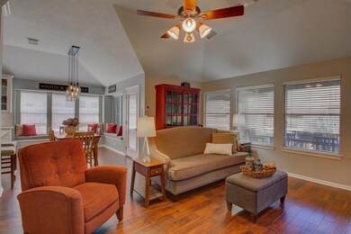Living room with a wall of windows to the back yard