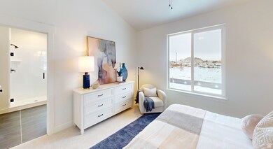 Bedroom featuring light carpet and vaulted ceiling