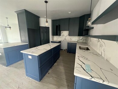 Gorgeous custom cabinets, granite.