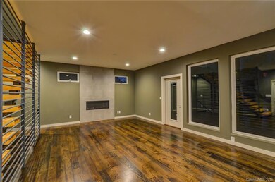 Open floor plan, hardwood floors, gas fireplace added as upgrade