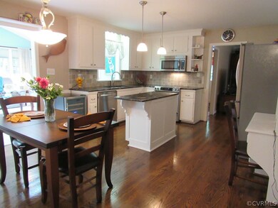 Spacious kitchen opens into vaulted great room
