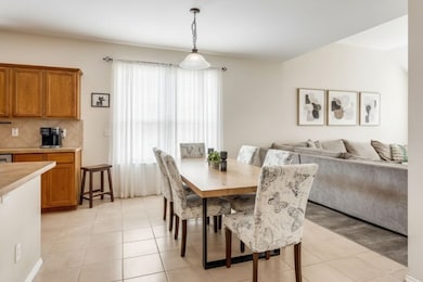Dining room featuring light tile patterned floors