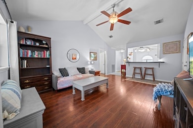 Look at all that room! Soaring high ceilings & plenty of space for large furniture arrangements.