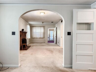 View from dining room through living room to front