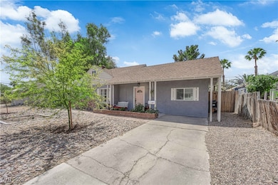 View of front of home featuring stucco siding, fen
