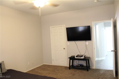 Bedroom featuring carpet floors, ceiling fan, and