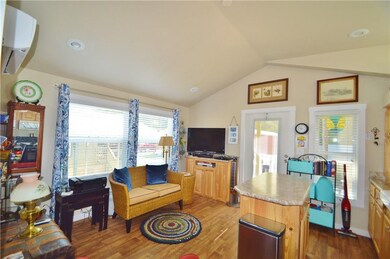 Living room, kitchen island on the right